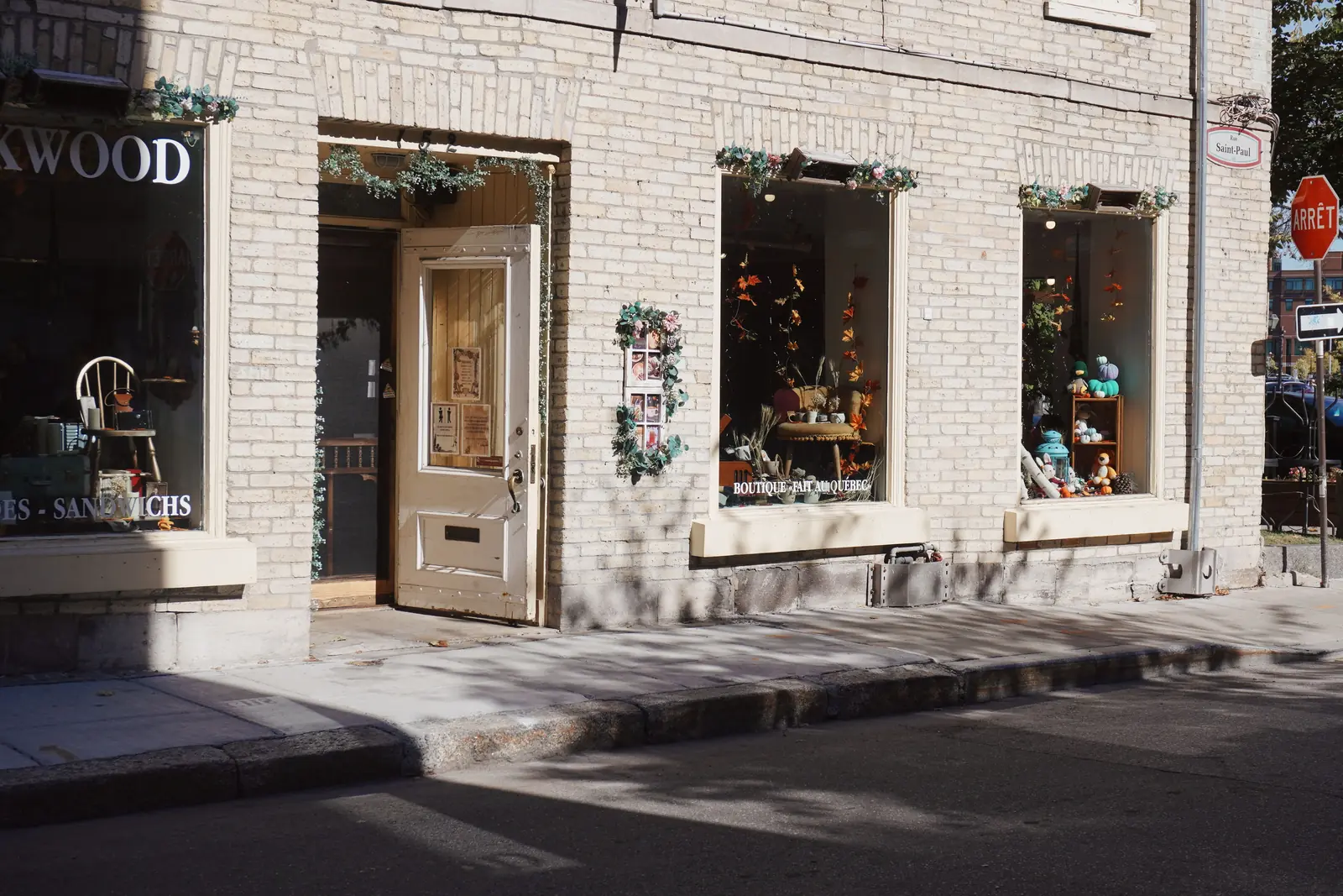 An independent boutique and cafe on a sunlit neighbourhood street corner