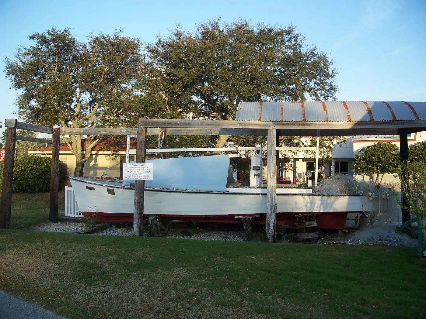 An old fishing boat on display outside the Destin History and Fishing Museum