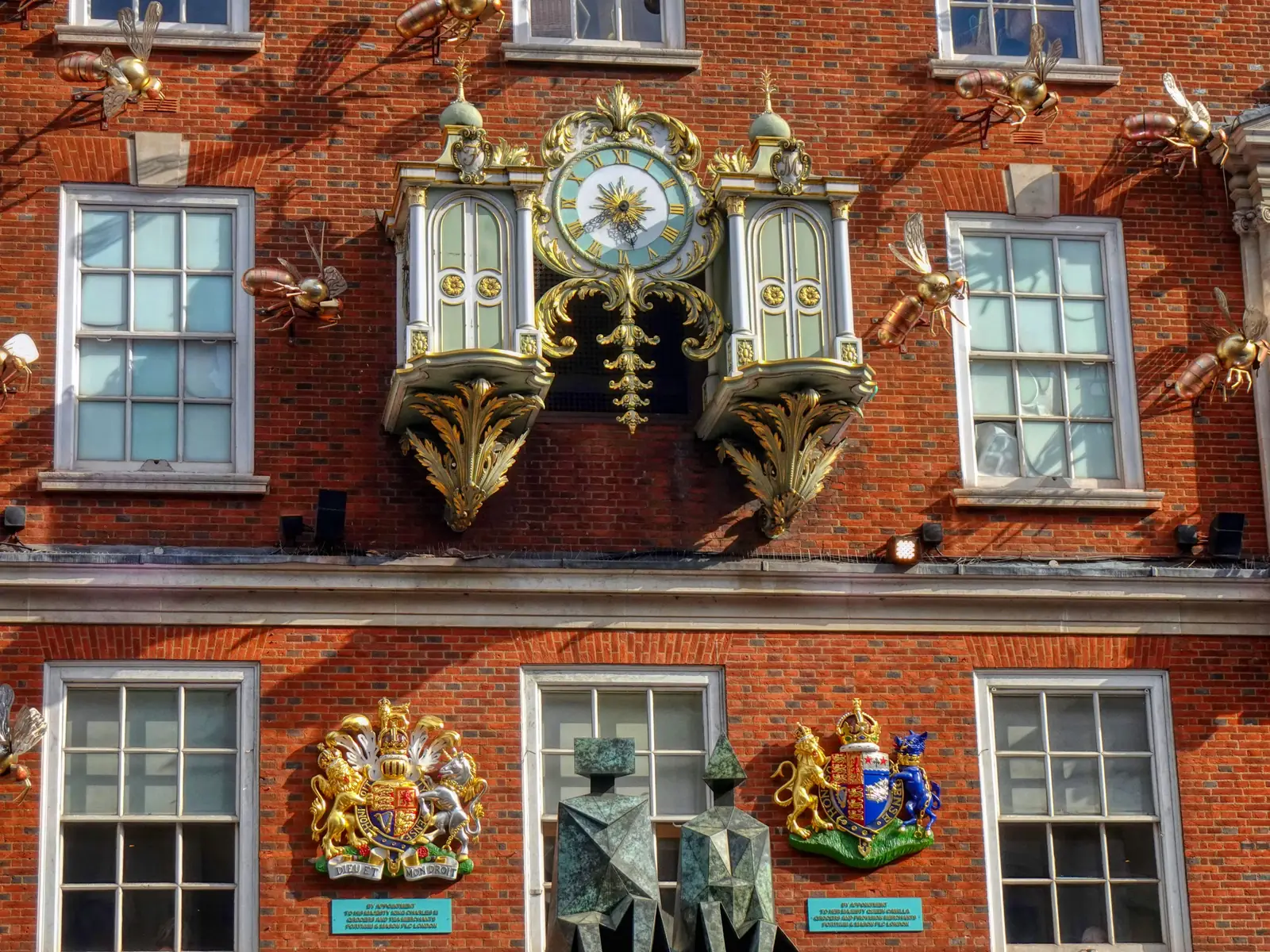 The ornate clock on the front of Fortnum and Mason on Piccadilly