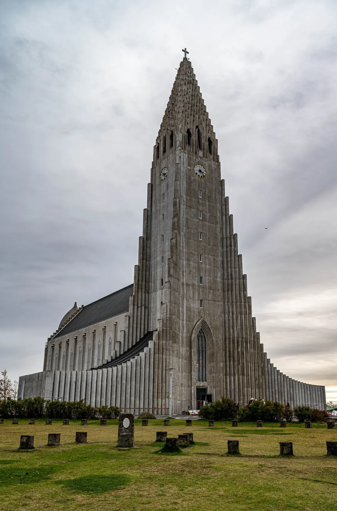 The concrete tower of Hallgrimskirkja church rising above Reykjavik under a grey sky