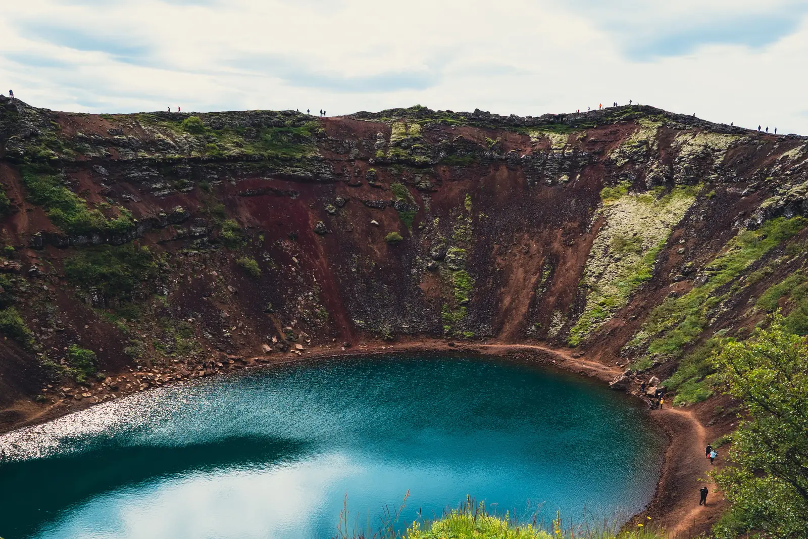 The red walls and turquoise lake of Kerid volcanic crater
