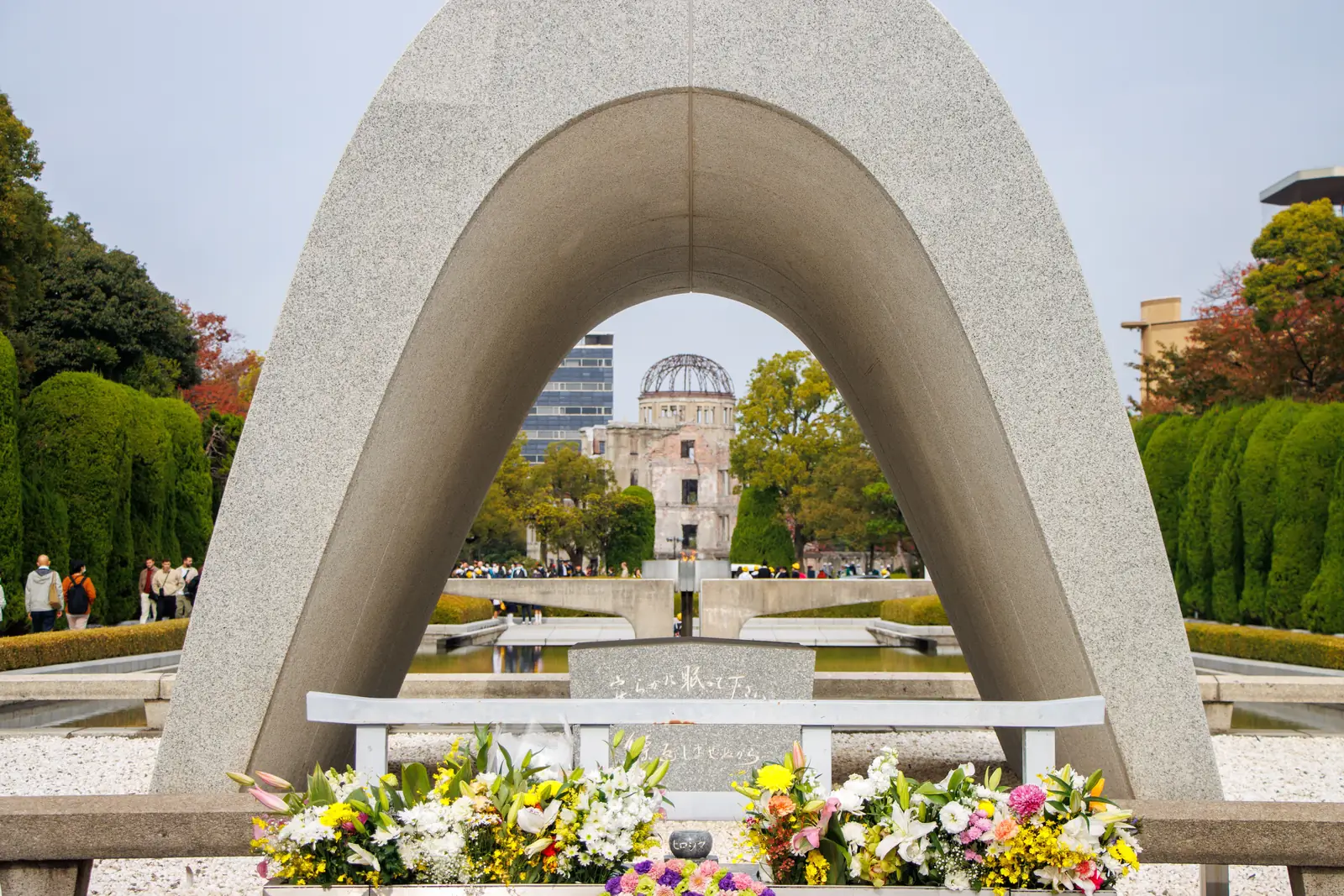 The cenotaph arch framing the Atomic Bomb Dome in Hiroshima Peace Memorial Park