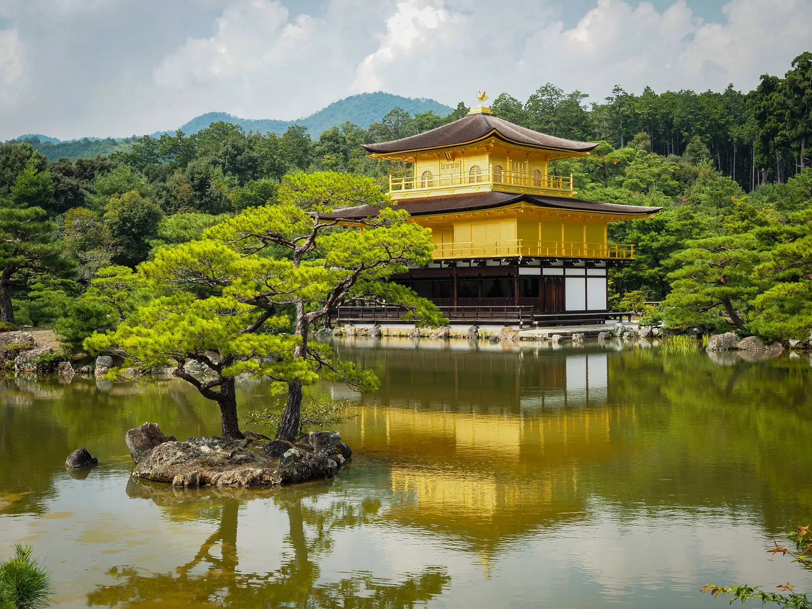 Kinkaku-ji, the Golden Pavilion, reflected in the pond in front of it