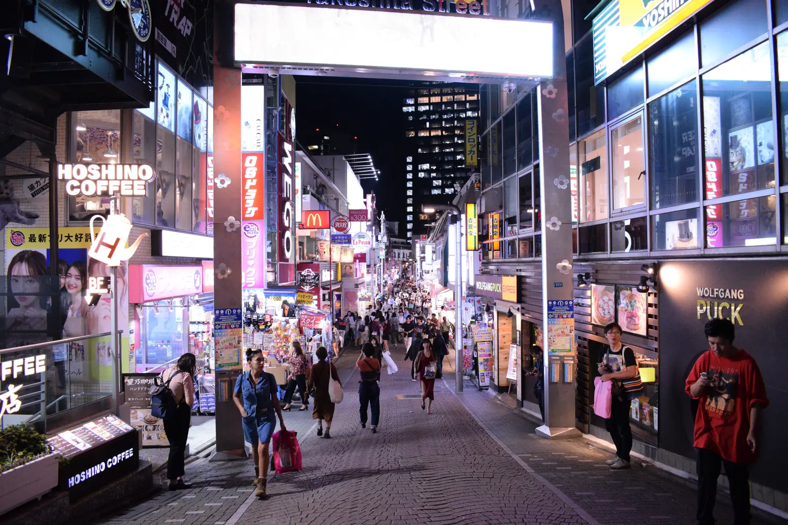 Shoppers walking down Takeshita Street in Harajuku, Tokyo