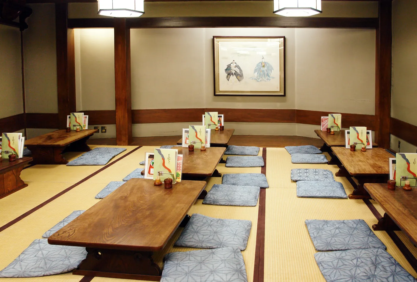 A traditional tatami ryokan room in Japan set for dinner