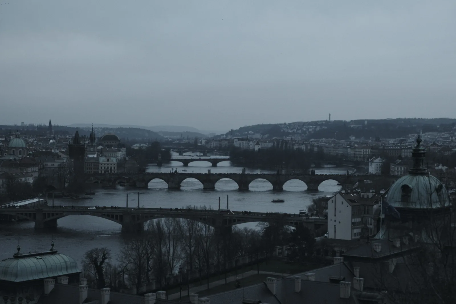 The bridges over the Vltava lined up on a grey winter day