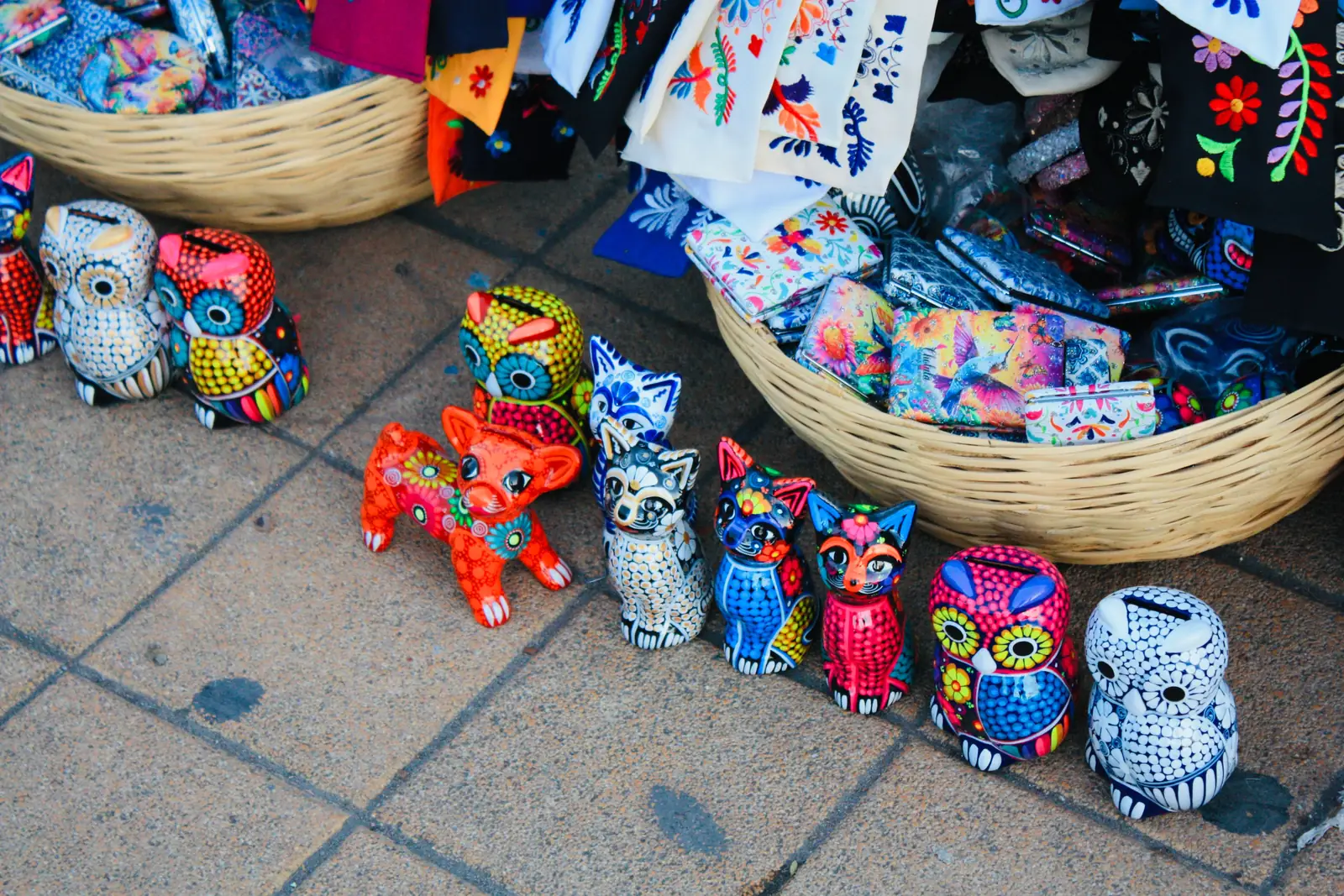 Brightly painted Mexican folk art figures on display