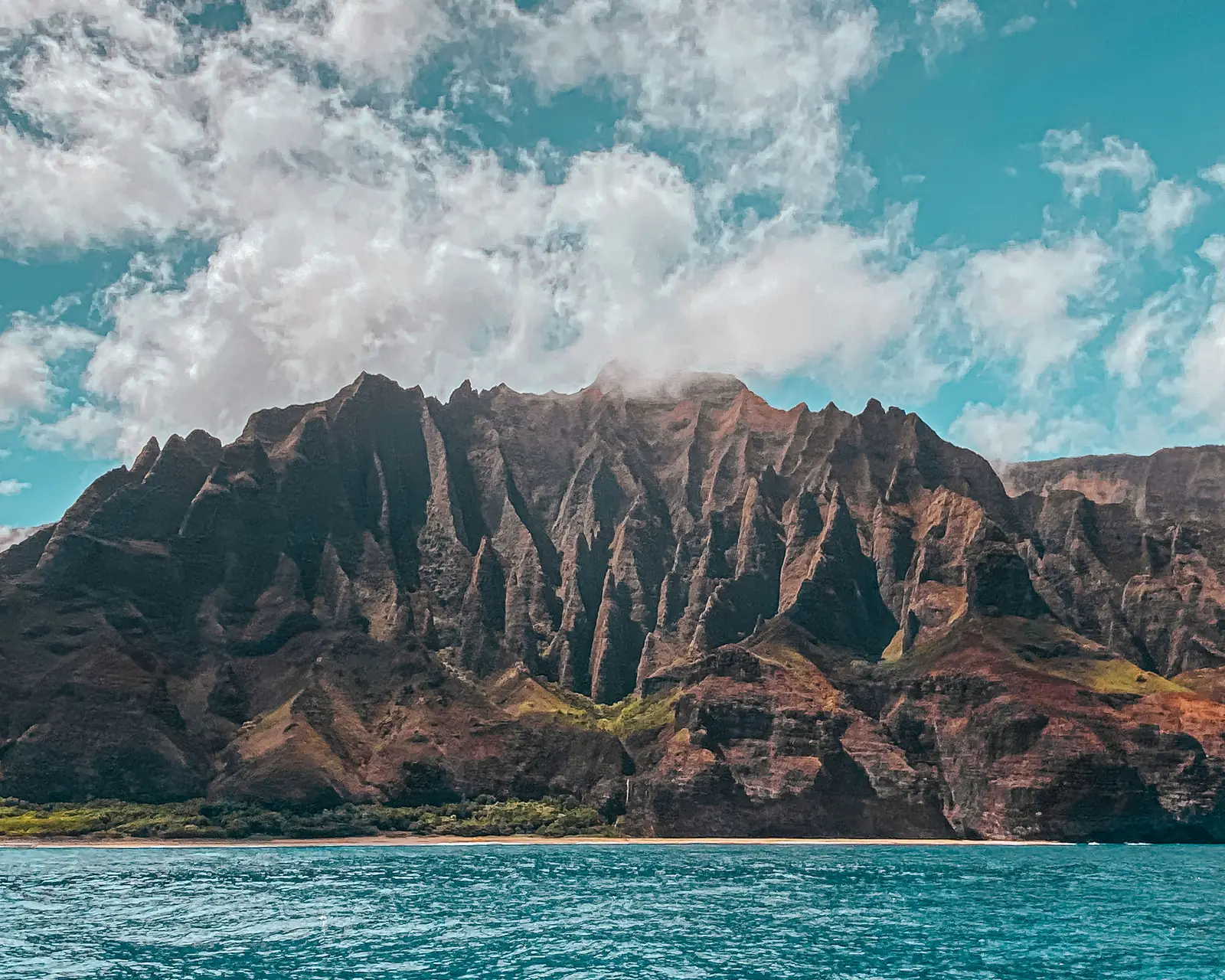 The Na Pali sea cliffs seen from the water on Kauai