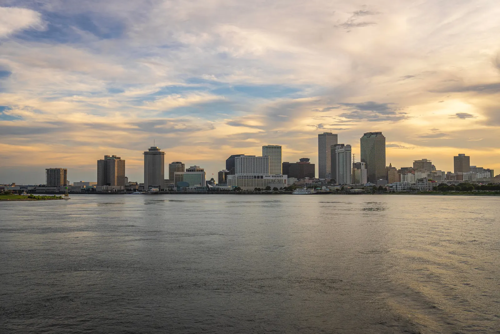 The New Orleans skyline across the Mississippi River at sunset
