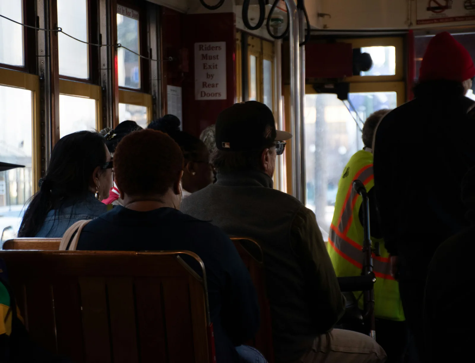 The view down the aisle of a New Orleans streetcar over the wooden seats