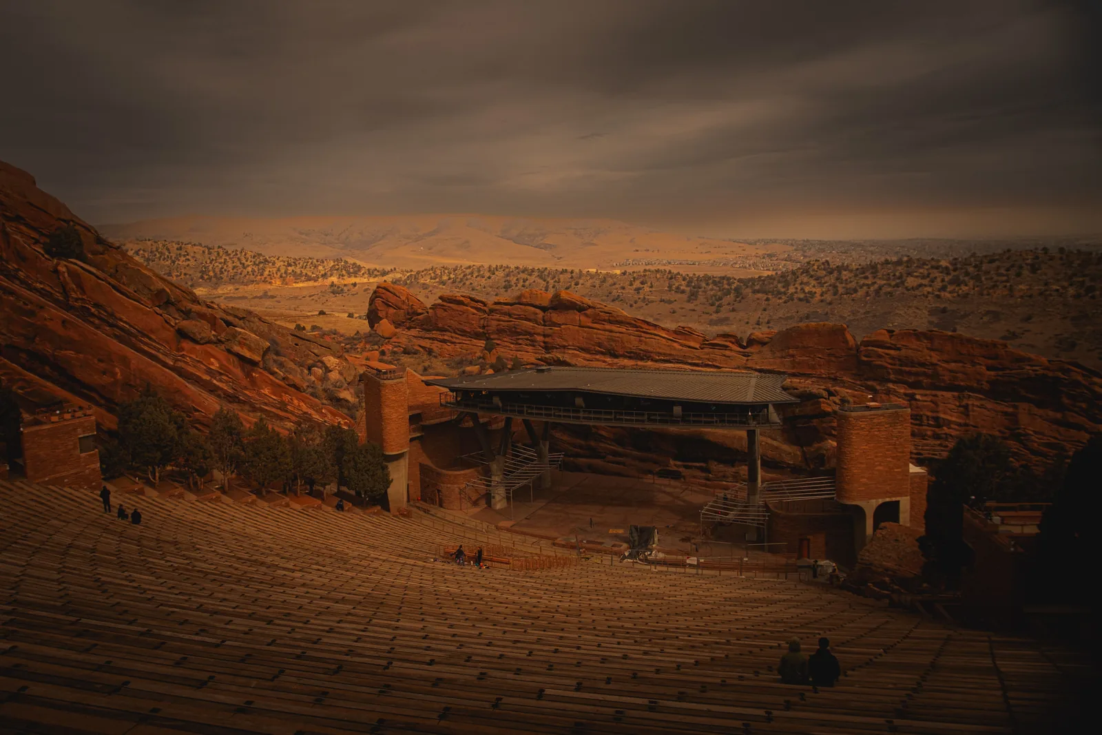 Red Rocks Amphitheatre between its sandstone slabs at dusk in Colorado