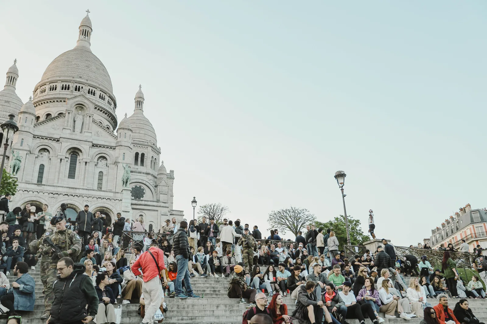 Visitors gathered on the steps below the Sacre Coeur basilica in Montmartre