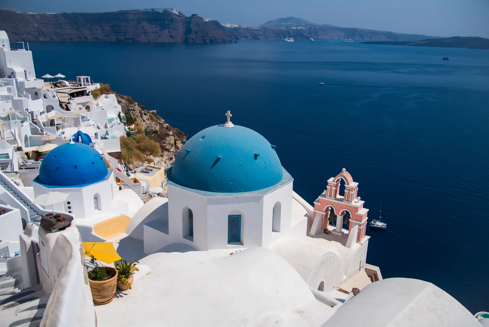 Blue domed churches above the caldera in Oia on Santorini, Greece