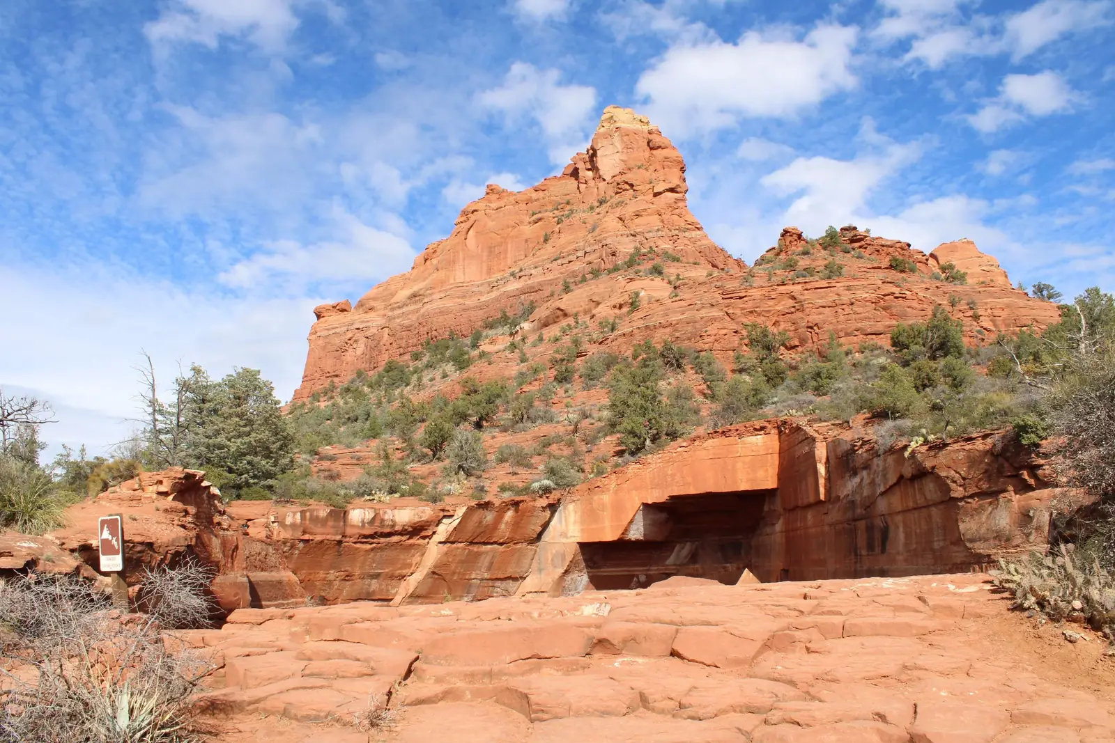 A wide view across the red rock formations of Sedona at golden hour
