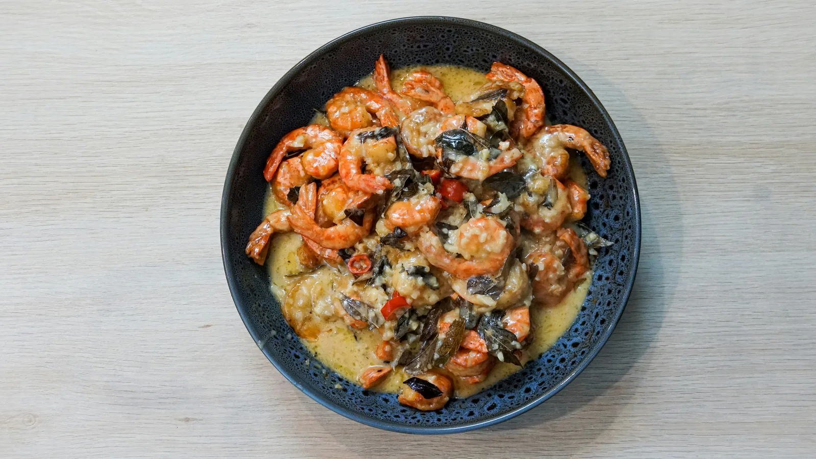 A bowl of shrimp and grits, the Lowcountry dish Charleston is known for