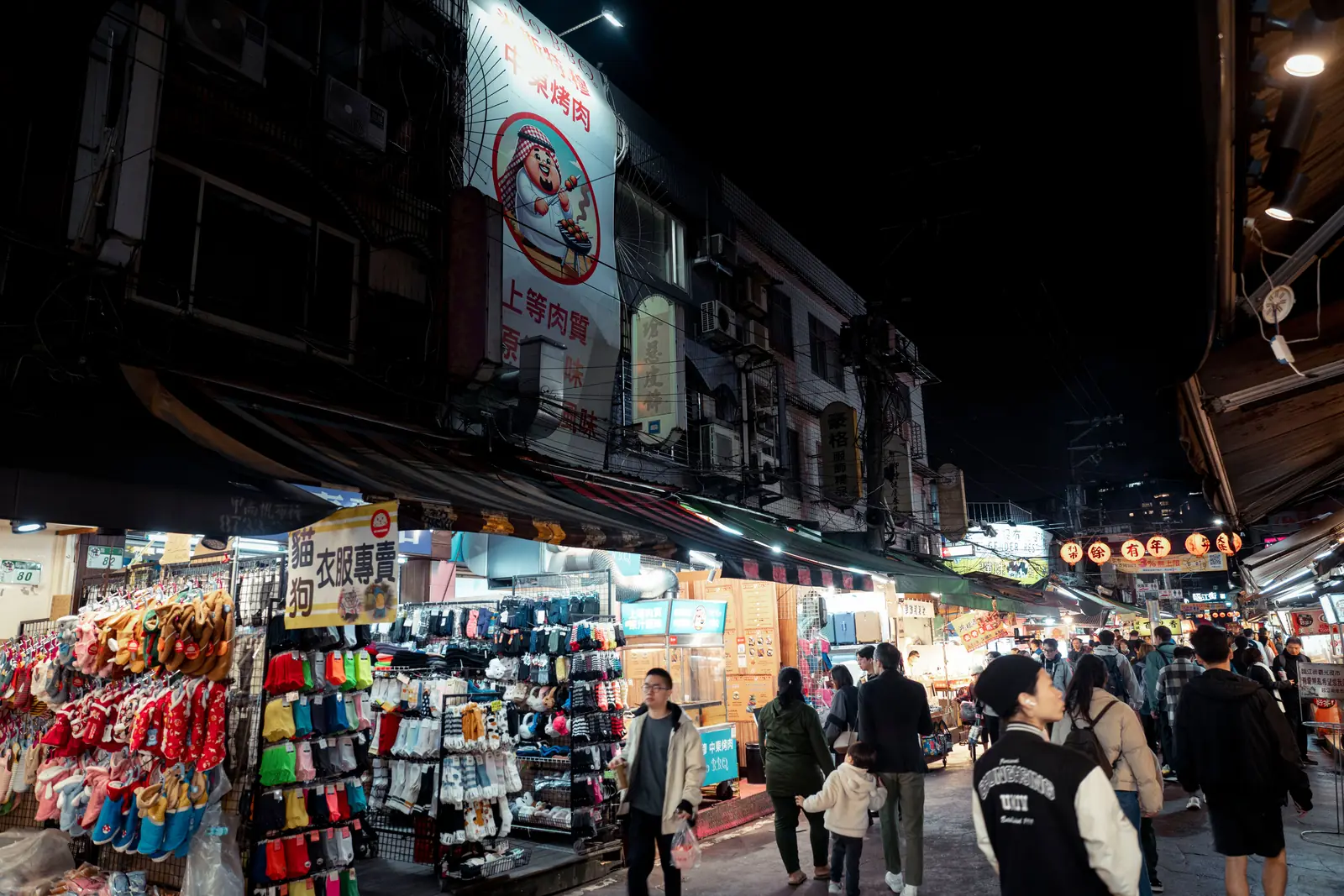 Shoppers walking through a busy night market in Taiwan