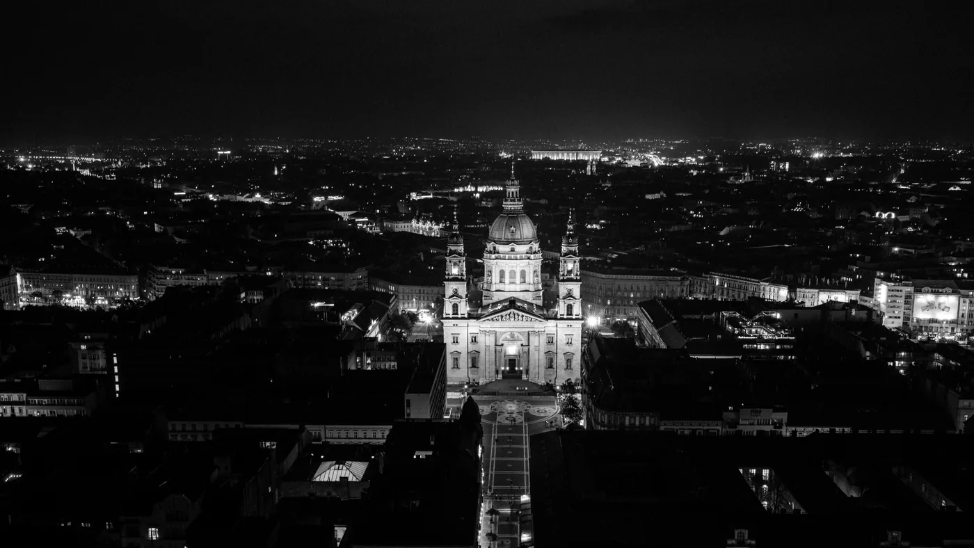 St. Stephen's Basilica lit up against the night sky in Budapest