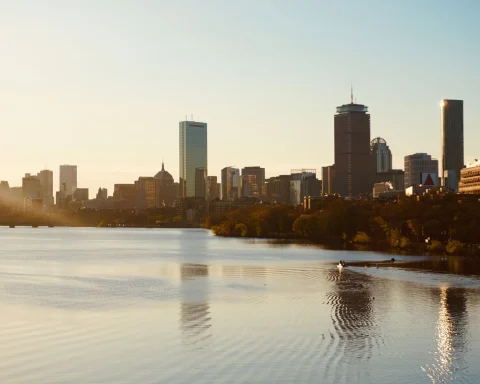 The Boston skyline at sunset seen across the Charles River
