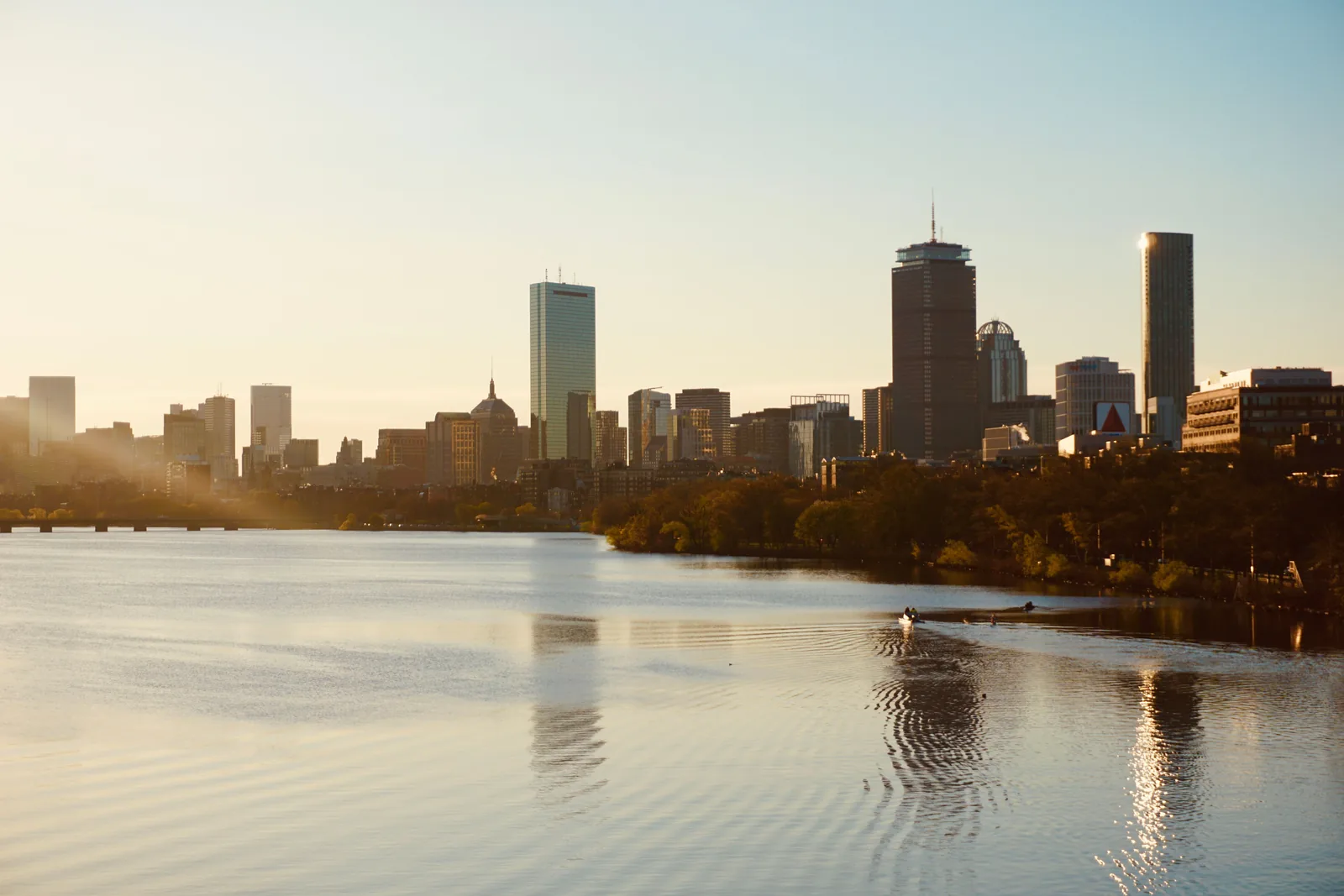 The Boston skyline at sunset seen across the Charles River