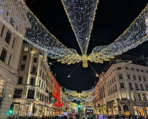 Christmas angel lights strung above Regent Street in London at night