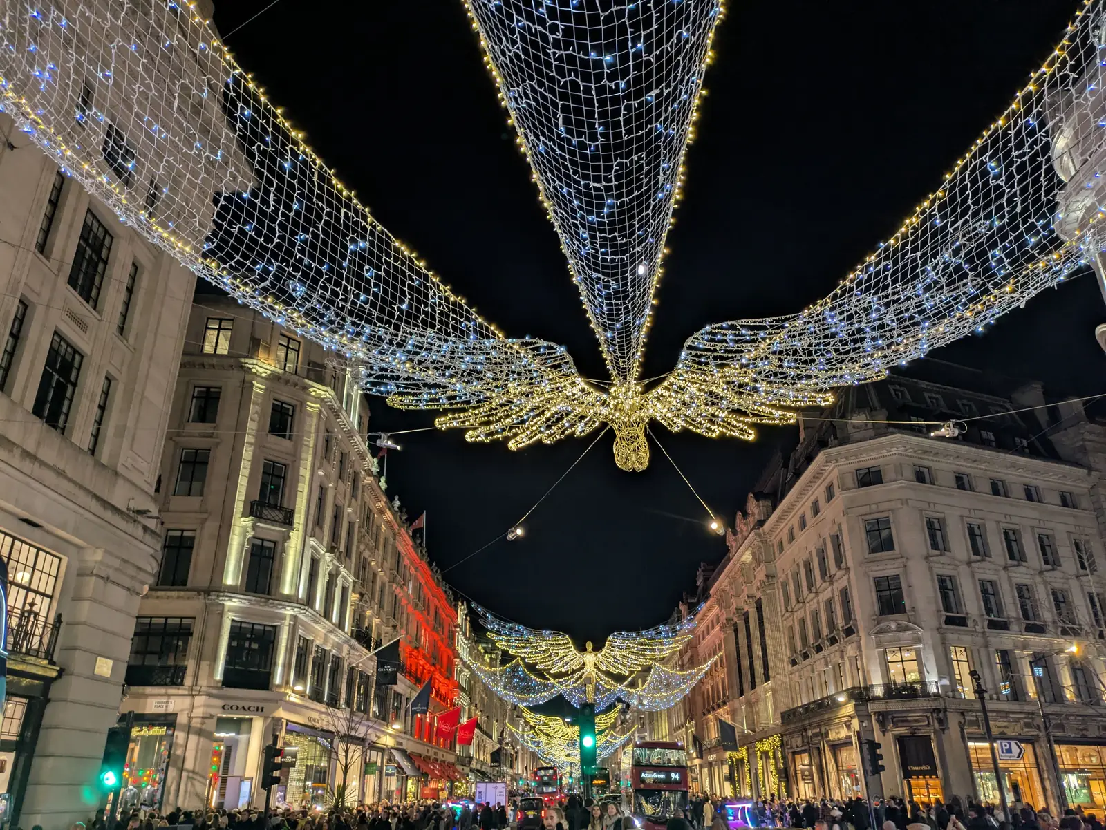 Christmas angel lights strung above Regent Street in London at night