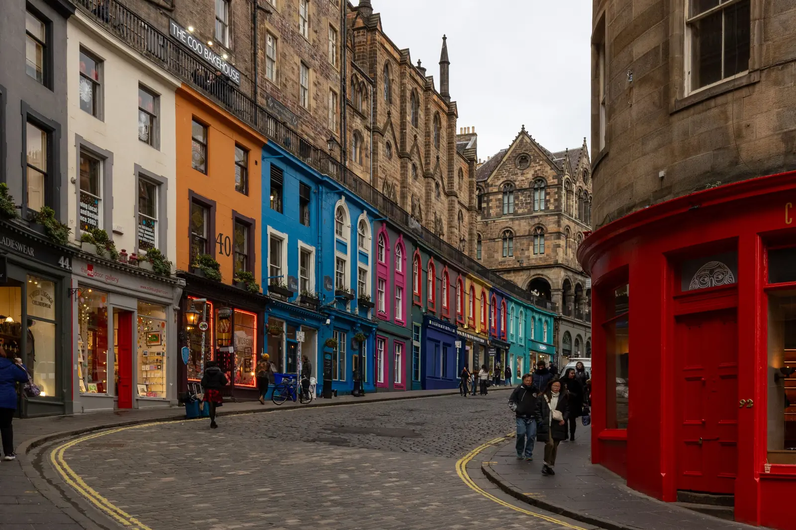 The coloured shopfronts curving down Victoria Street in Edinburgh