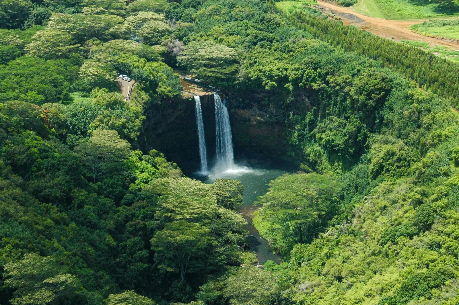 Wailua Falls dropping in two ribbons through dense green on Kauai