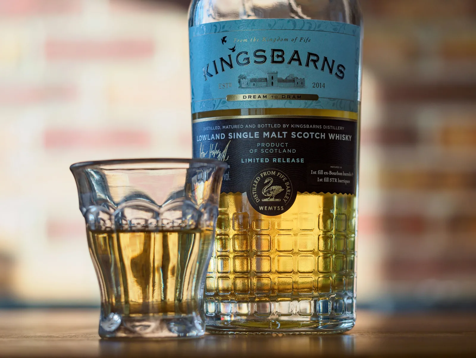 A bottle and glass of Scottish single malt whisky