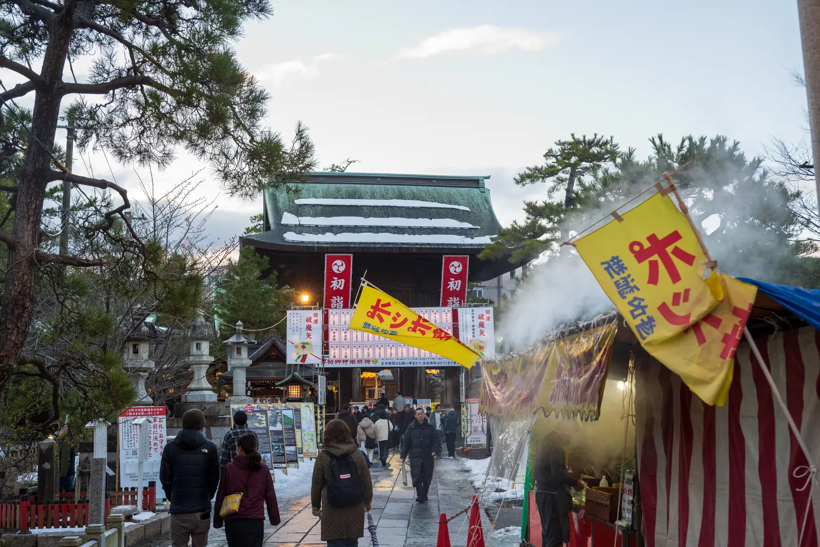 Food stalls on the approach to a shrine in winter