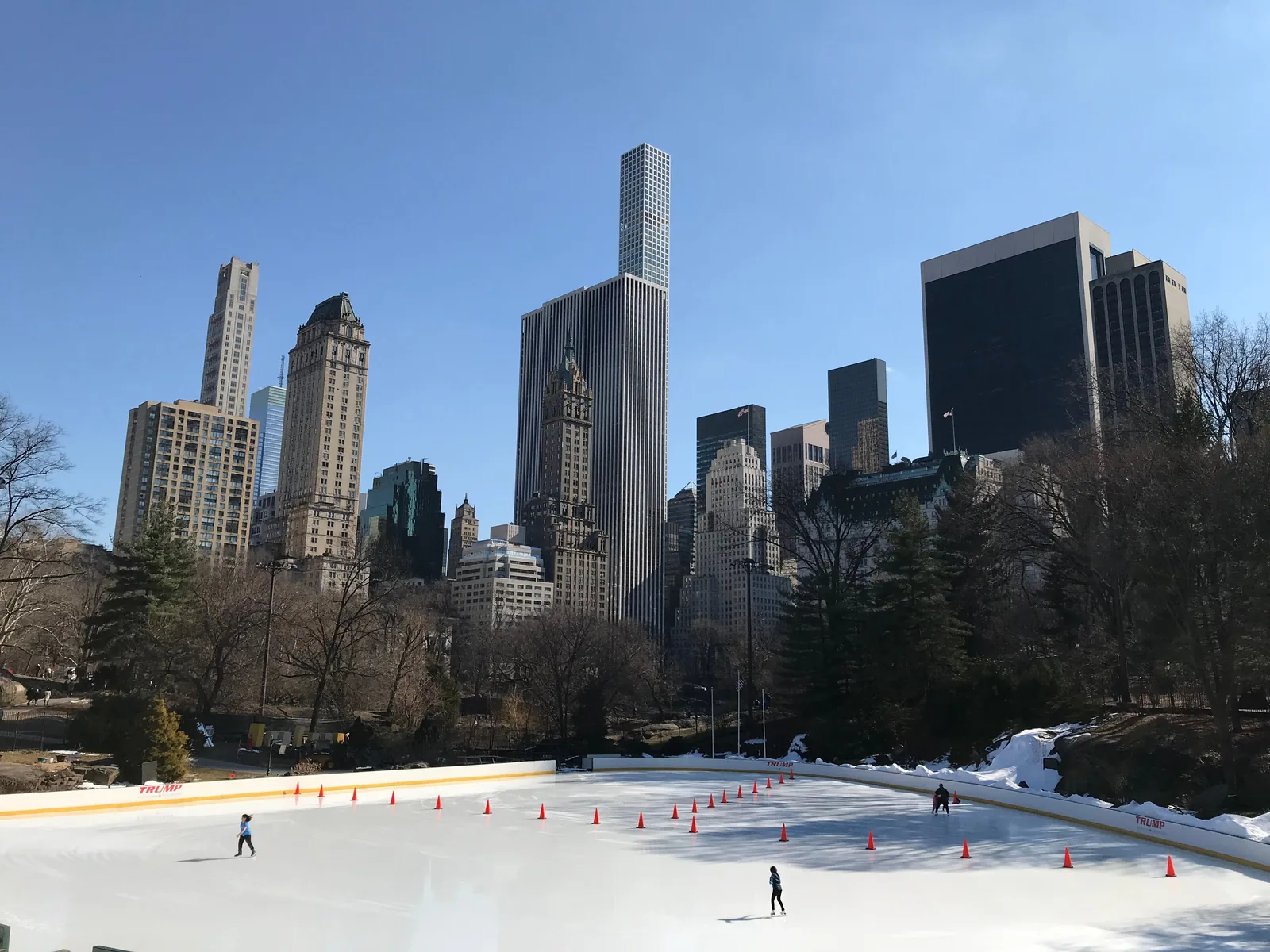 The ice rink at the south end of Central Park with the skyline behind it