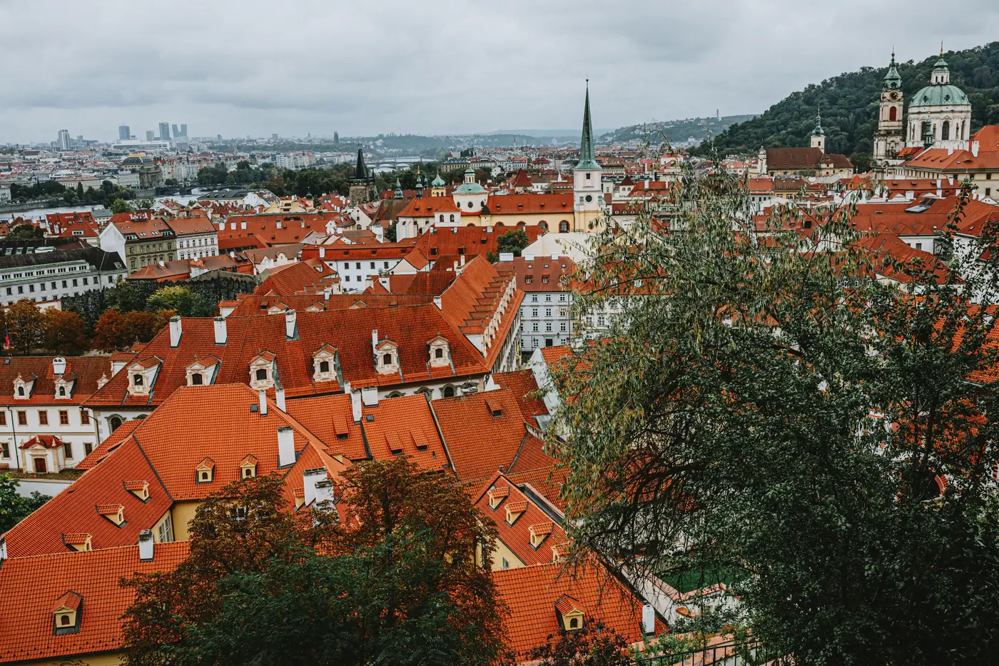 Red rooftops and church towers of Prague's historic center