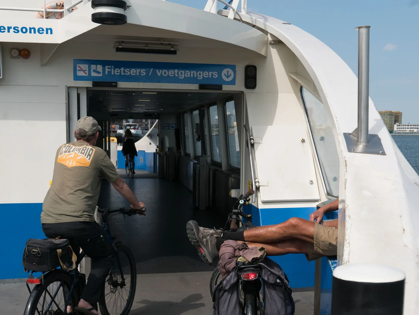 A cyclist boarding one of the free ferries across the IJ in Amsterdam