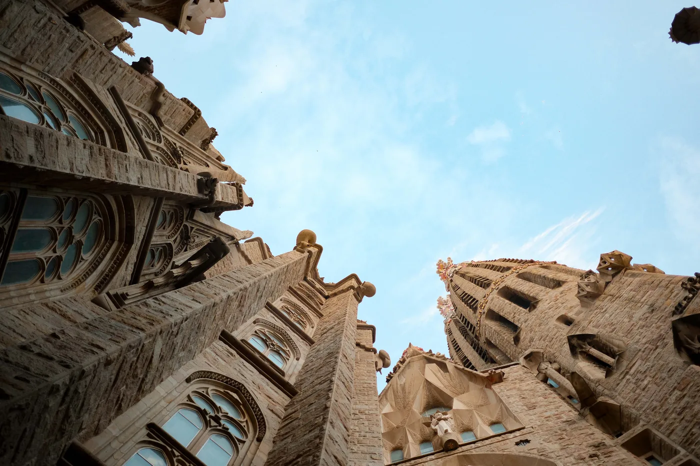 The towers of the Sagrada Familia against a blue sky in Barcelona