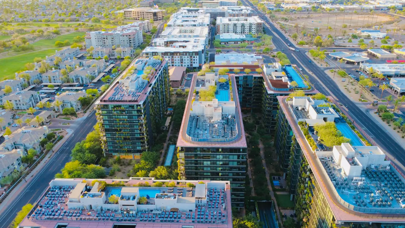 Aerial view of Scottsdale, Arizona at sunset with mountains behind