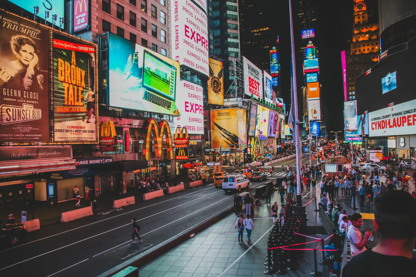 Broadway show billboards lighting up Times Square at night