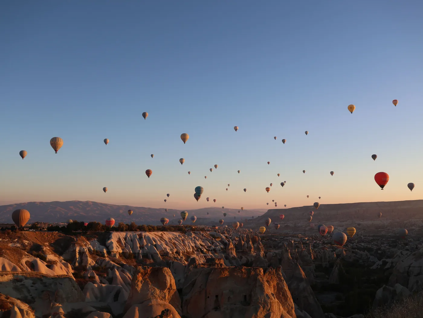 Hot air balloons over the rock formations of Cappadocia