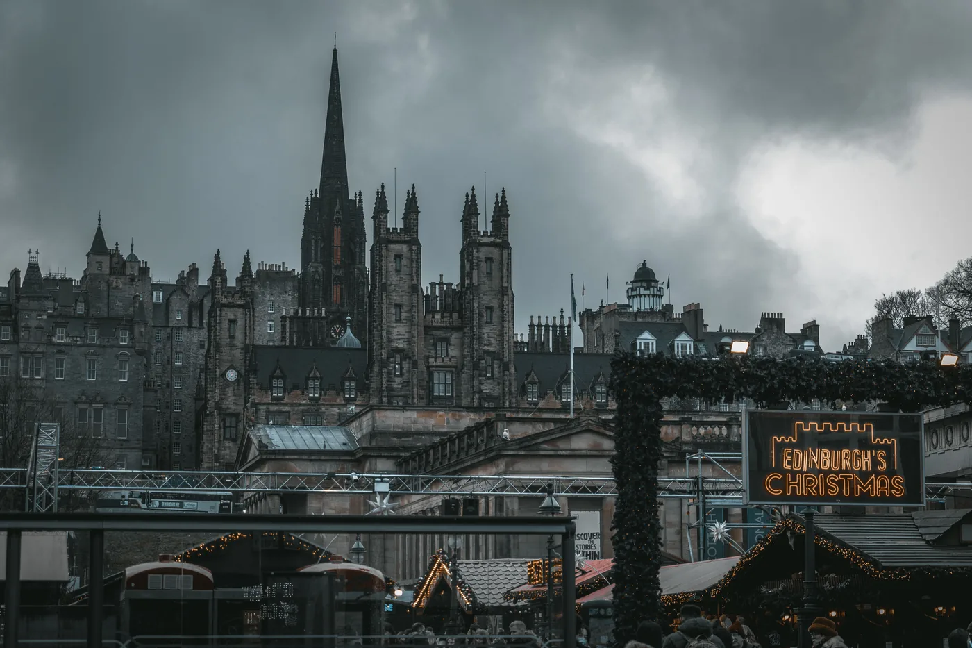 The Edinburgh's Christmas sign below the Old Town skyline in Edinburgh