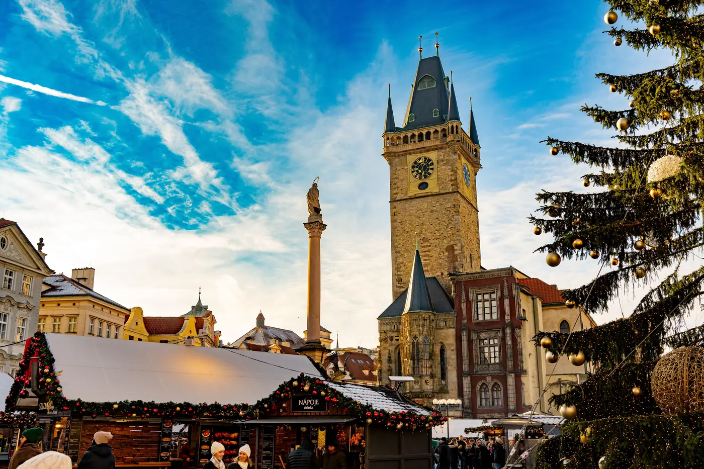Christmas market stalls and a decorated tree on Old Town Square in Prague