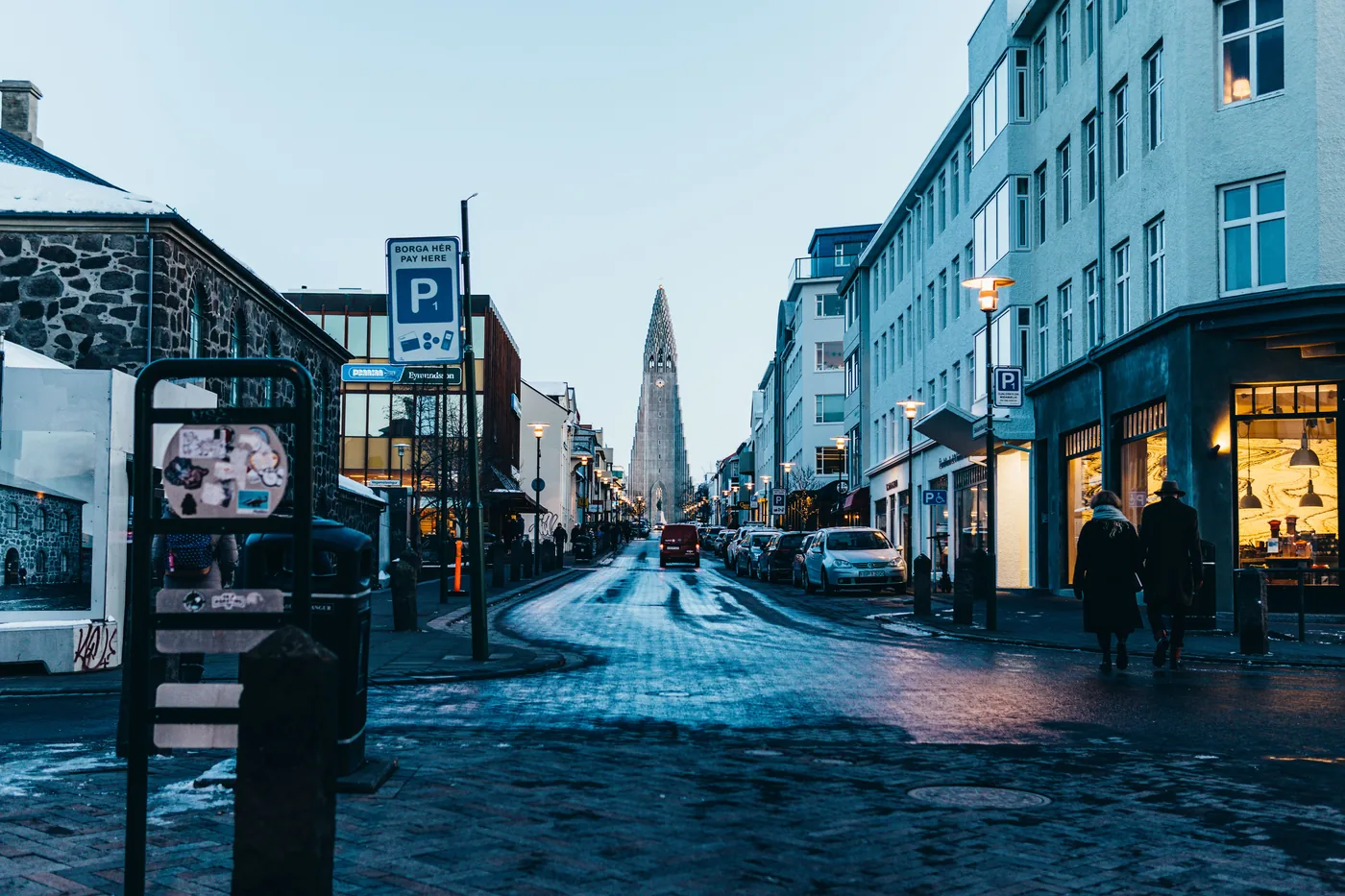A snowy street in Reykjavik leading up to Hallgrimskirkja church