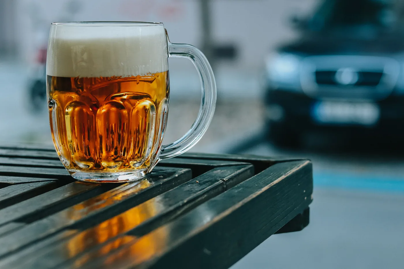 A frosty glass of pilsner on a table in Prague