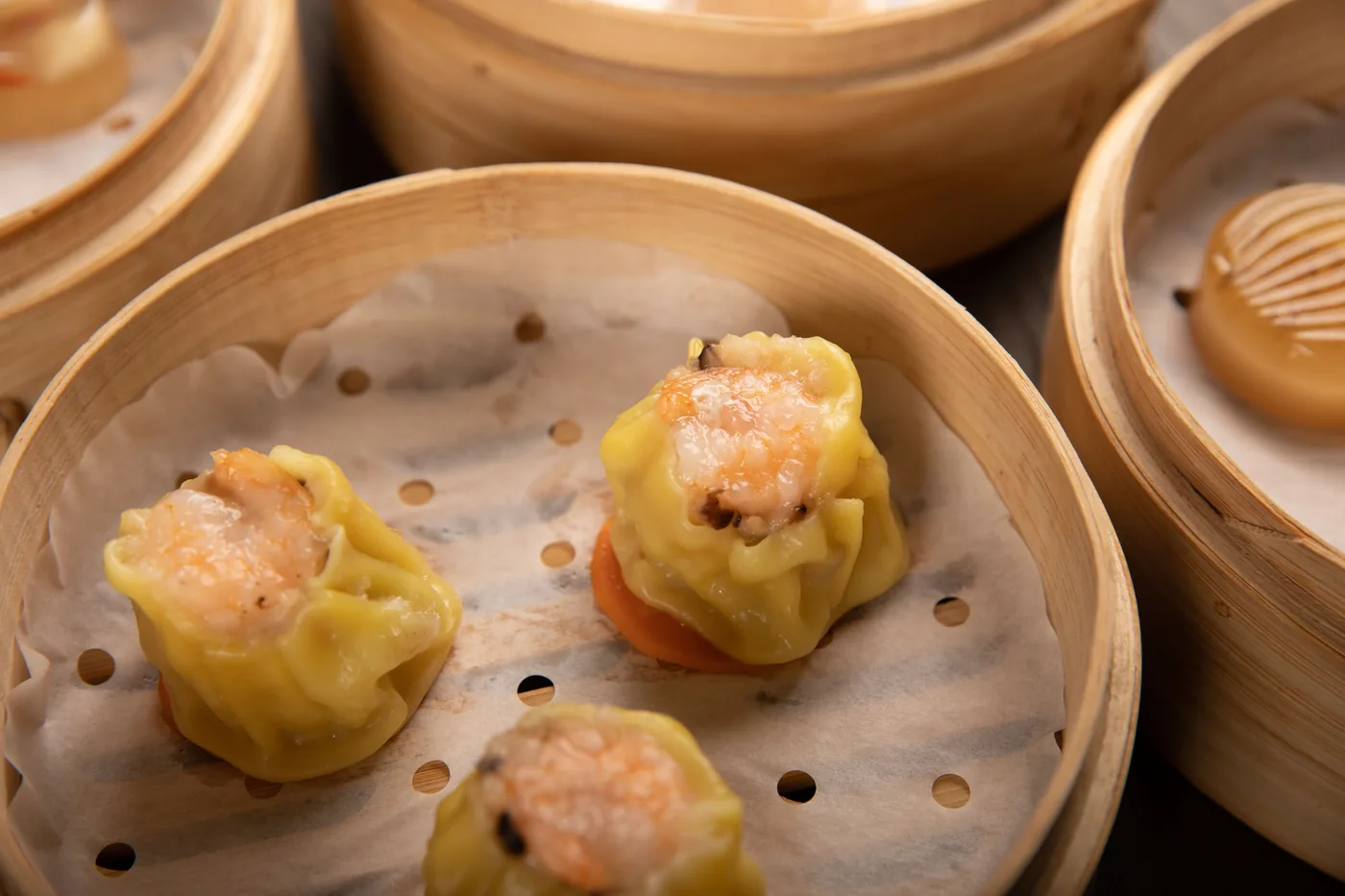 Shumai dumplings in a bamboo steamer