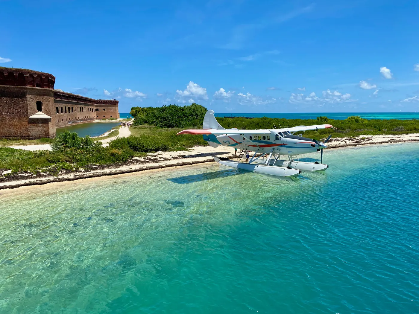 A seaplane docked beside Fort Jefferson in Dry Tortugas National Park