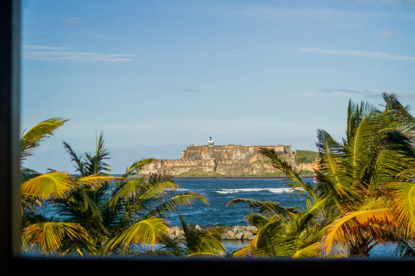 El Morro fortress seen through palm trees in San Juan