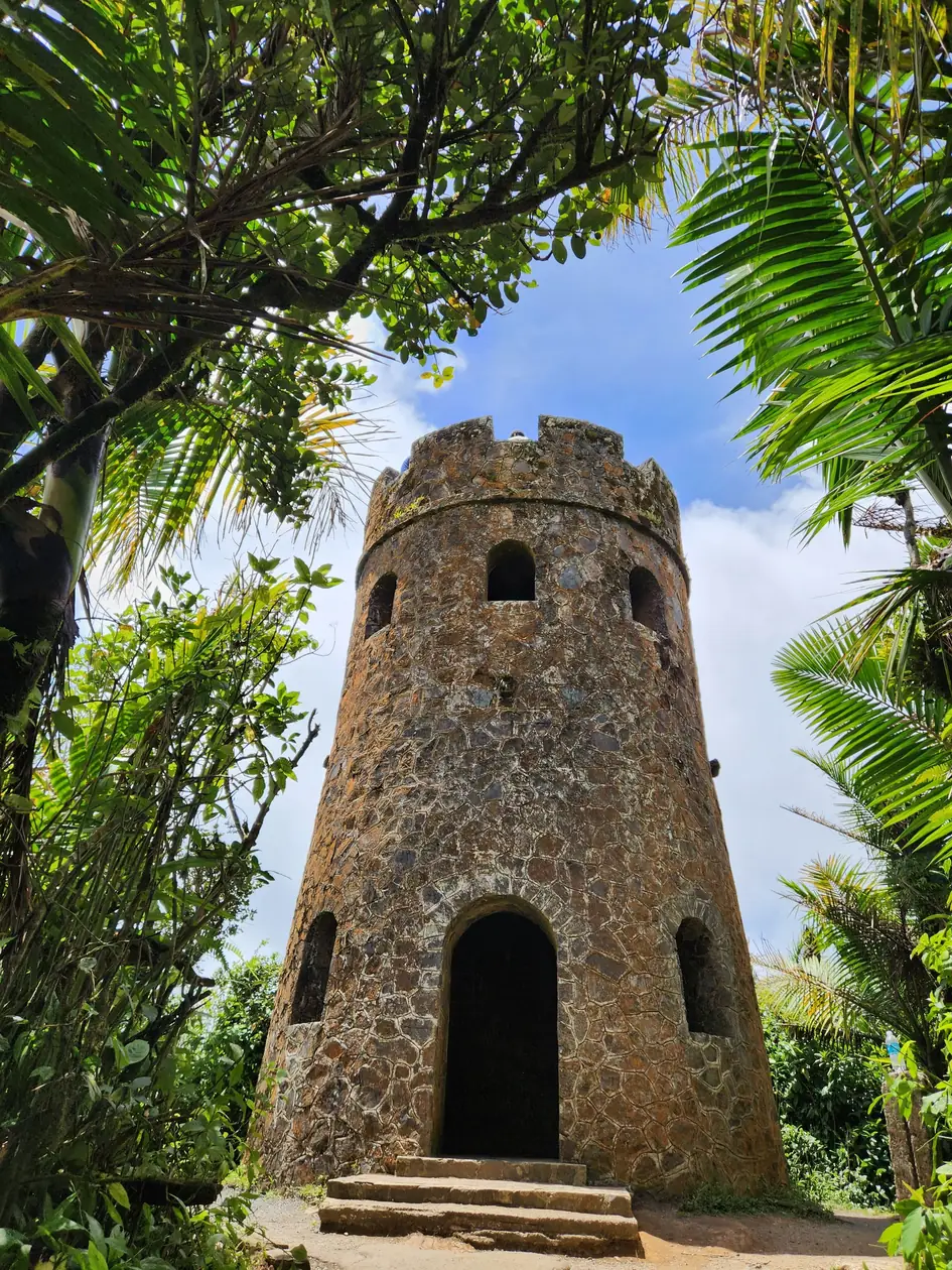 A stone lookout tower surrounded by rainforest in El Yunque