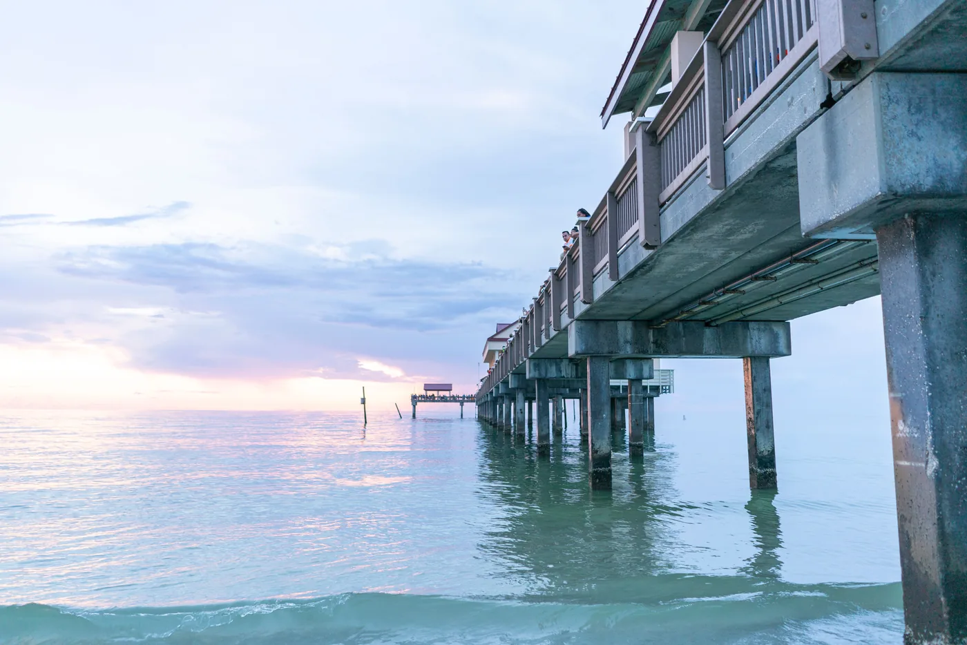 The pier at Clearwater Beach at sunset over calm water