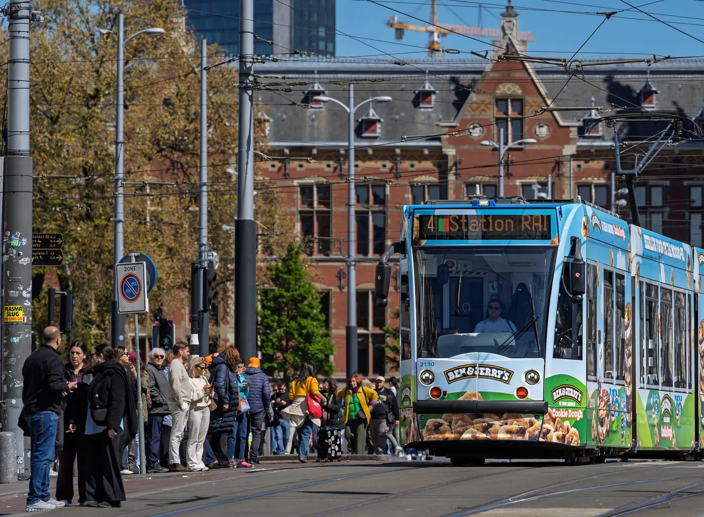 A tram on a busy street in Amsterdam