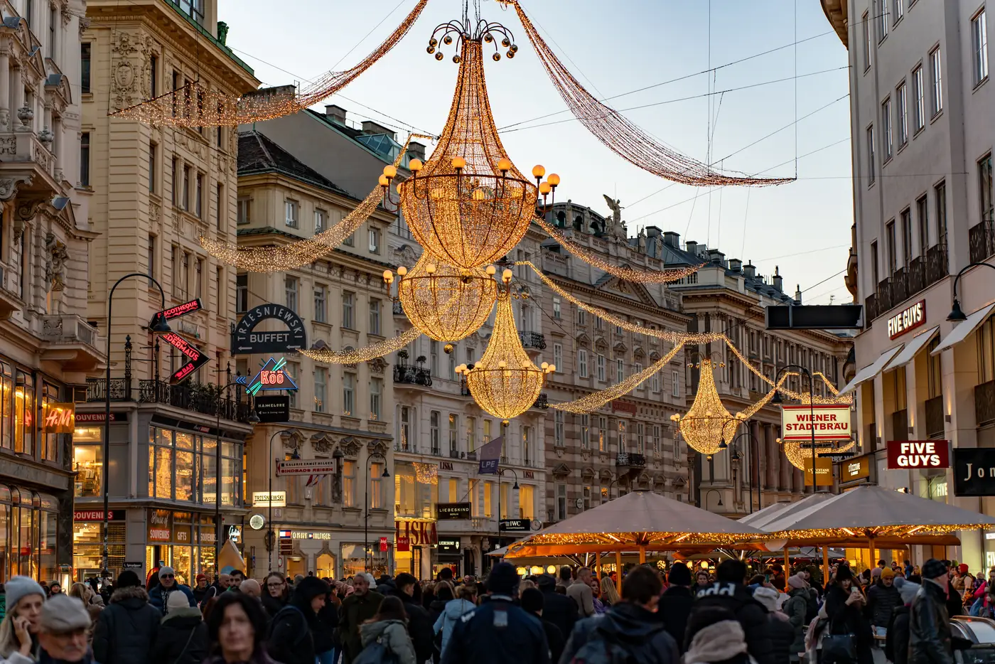 Chandelier shaped Christmas lights hanging above Graben street in Vienna