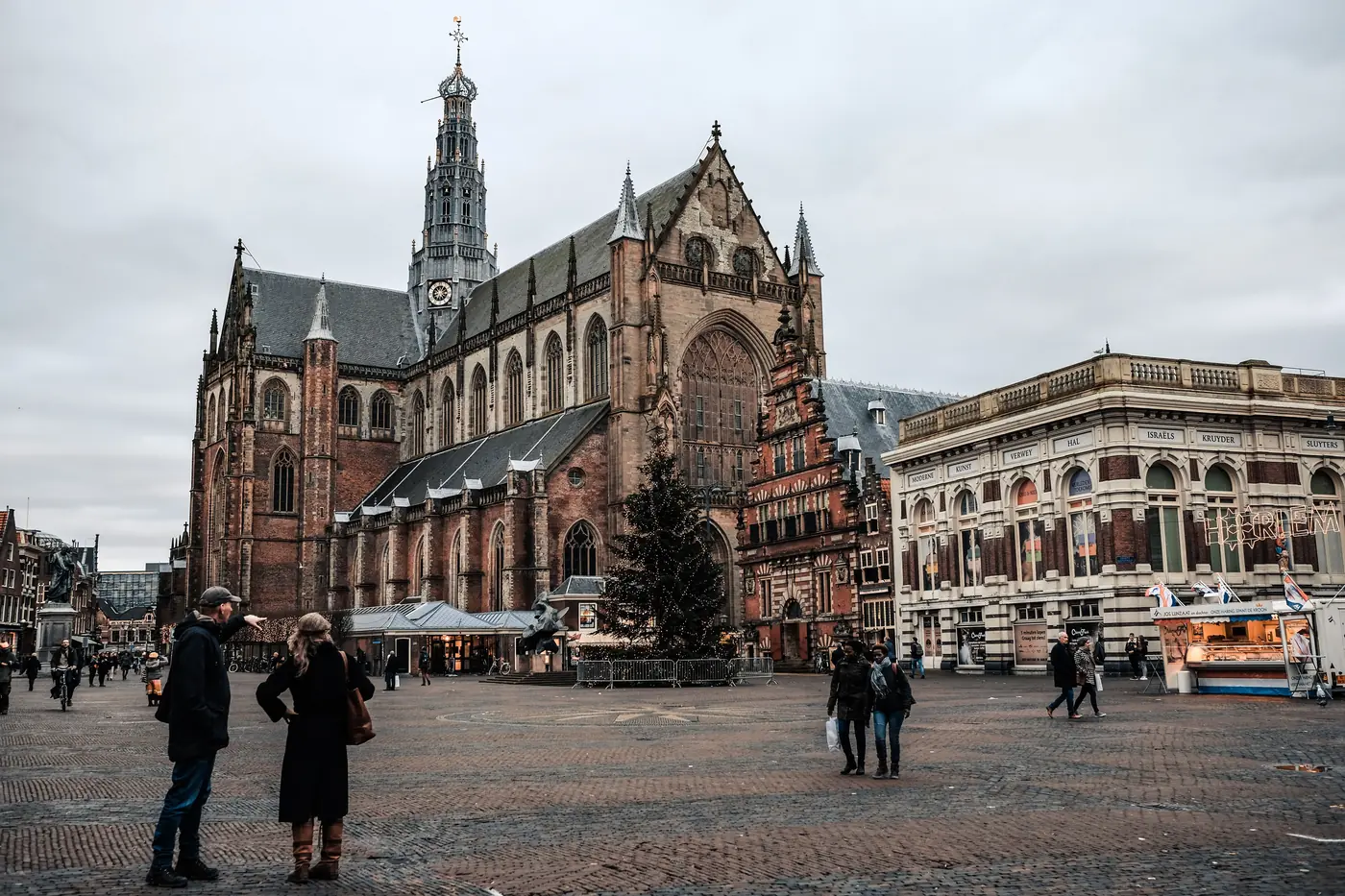 The Grote Markt in Haarlem with St. Bavo church and a lit Christmas tree in winter
