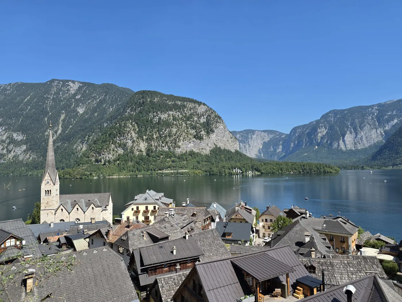 Hallstatt's church and rooftops beside the lake in Austria