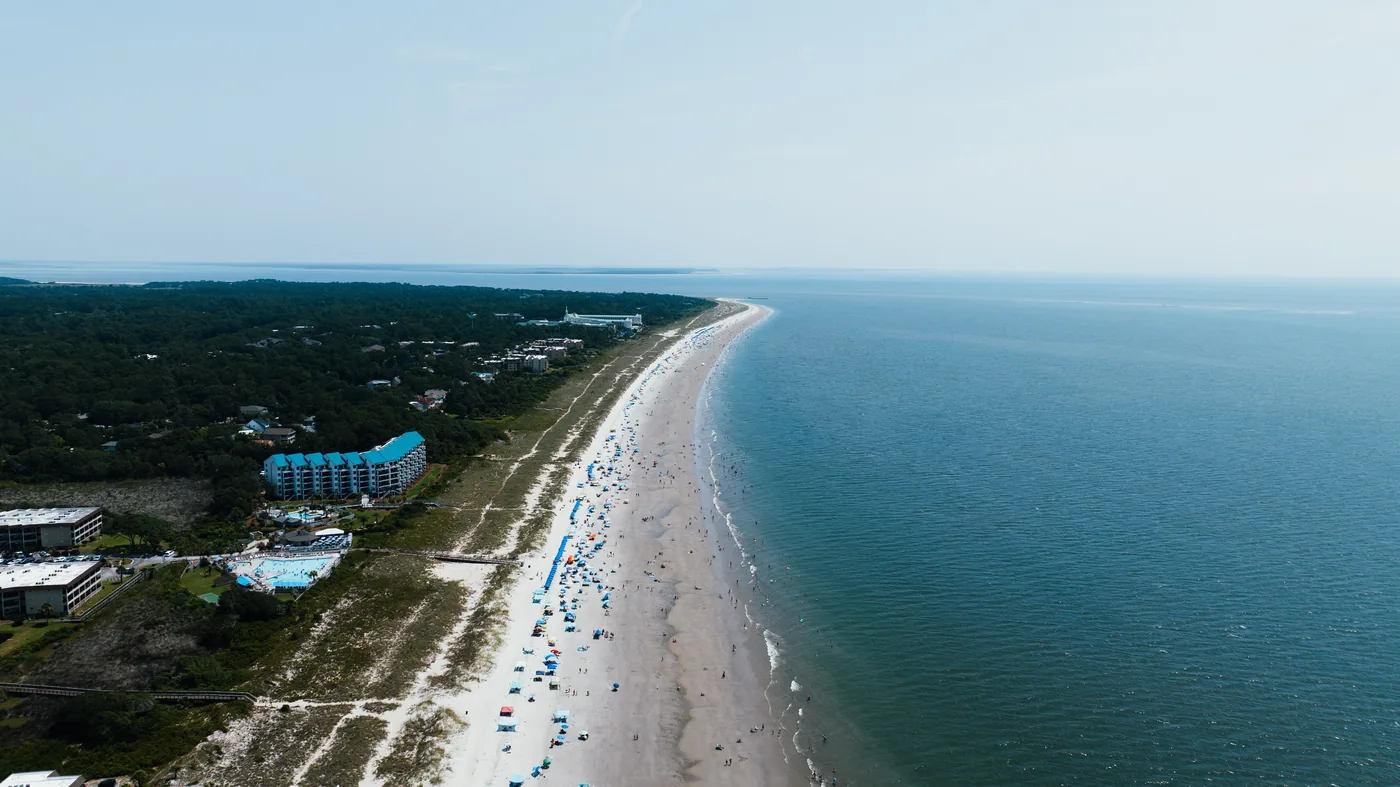 The wide beachfront and low treeline of Hilton Head Island in South Carolina